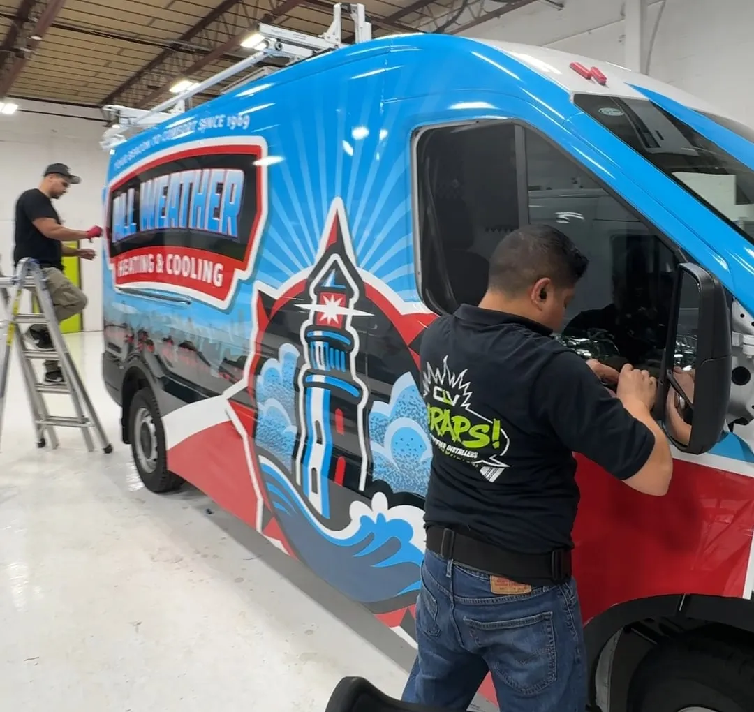 CL Visual installer hand-trimming vinyl wrap inside a vehicle door jamb in Copiague, NY