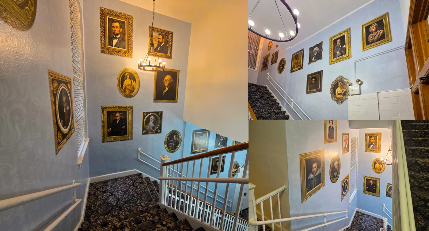 Stairwell wall wrap featuring a gallery of framed portrait graphics, installed by CL Visual