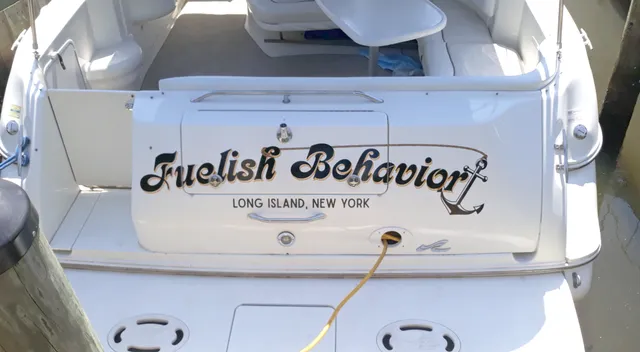 Fuelish Behavior boat name and hailing port lettering