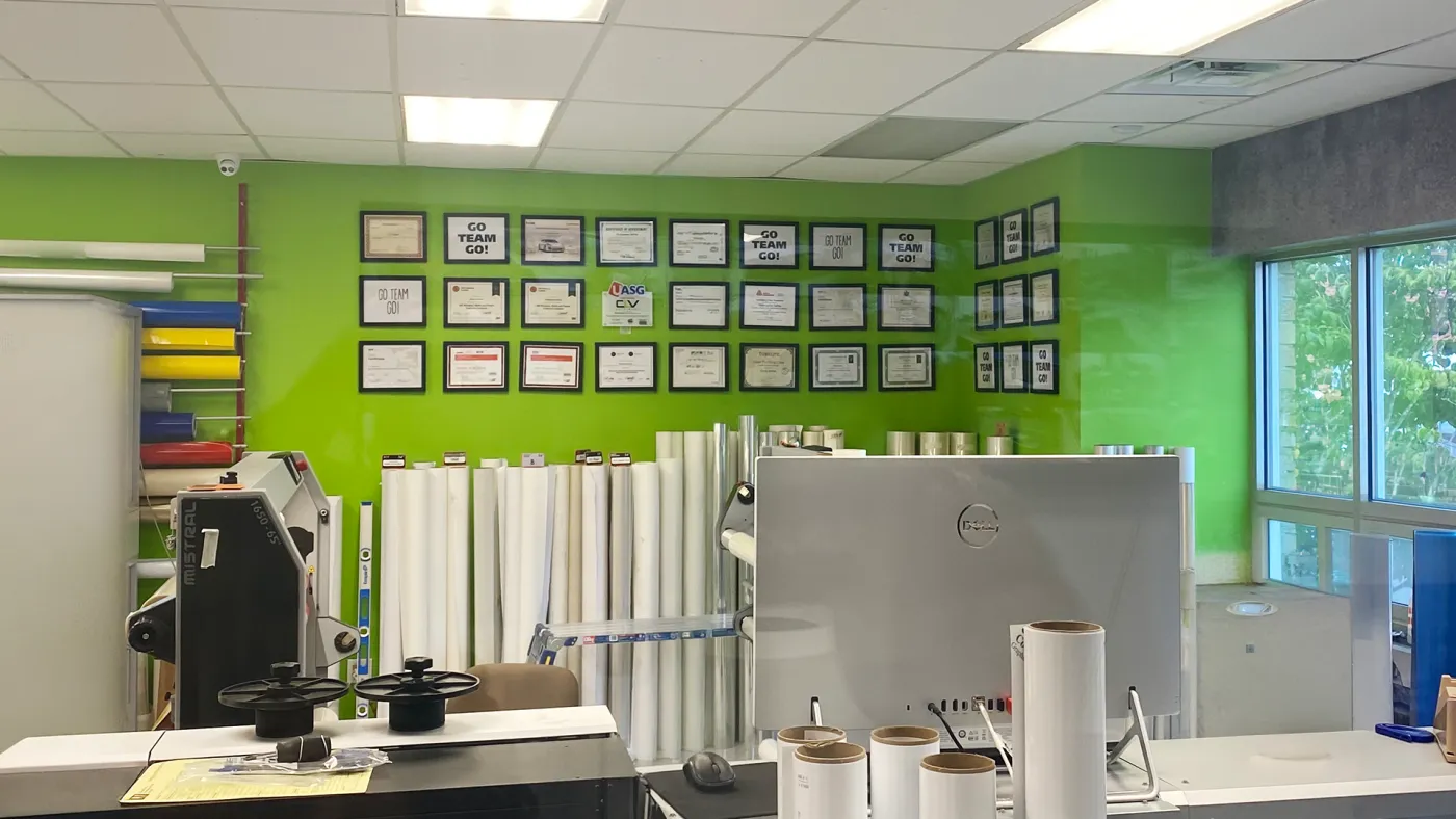 CL Visual's certification wall lined with manufacturer and training credentials
