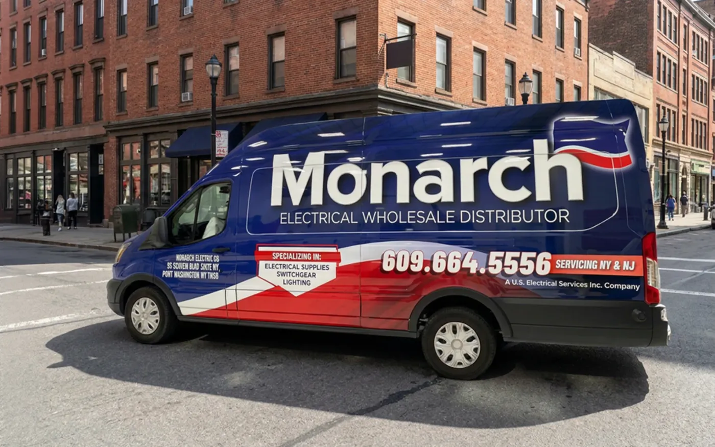 Monarch Electrical Wholesale Distributor van wrap by CL Visual, parked on a city street corner