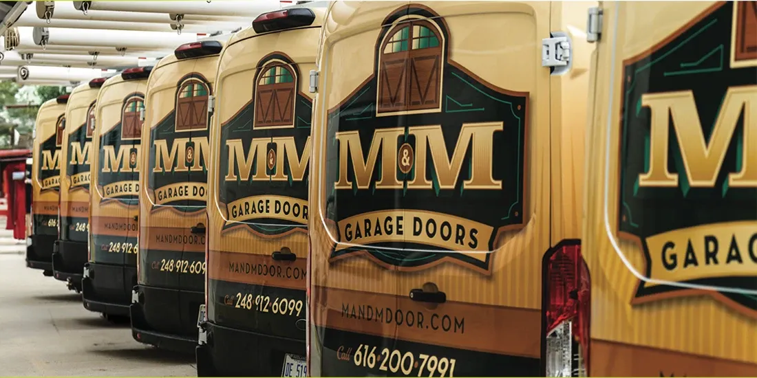 Fleet vehicles wrapped by CL Visual for M&M Garage Doors