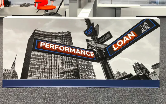 Performance and Loan street-sign desk divider film