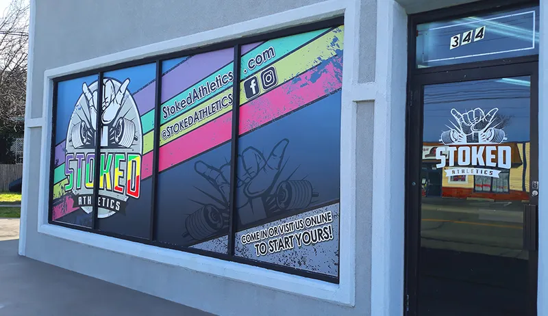 Stoked Athletics storefront window graphics