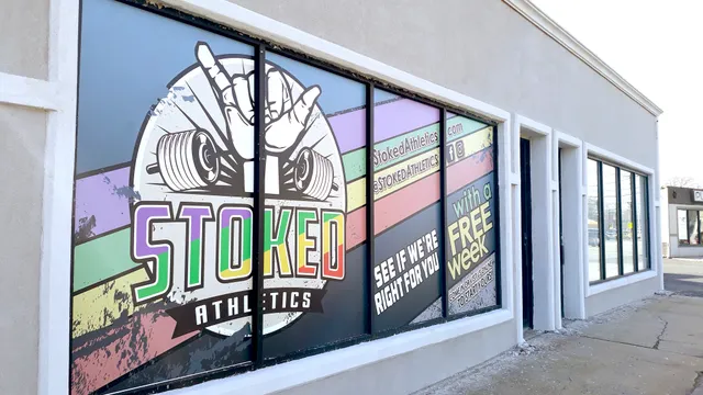 Stoked Athletics storefront window graphics